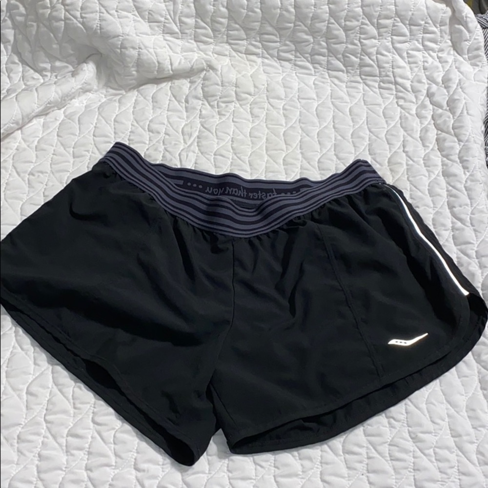 Saucony run/dry shorts with secret pocket on back.
